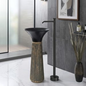 Liniyo freestanding resin pedestal basin with wide dramatic matte black flared bowl on richly shimmering gold fluted column pedestal and gunmetal floor faucet