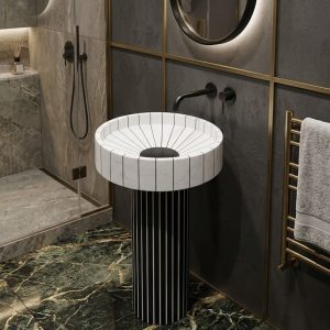Sunburst white marble effect artificial stone freestanding pedestal basin with radiating ribbed bowl on black white striped fluted column in dark luxury bathroom