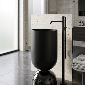 Wine Glass Black freestanding stainless steel pedestal basin with wide matte black cylinder bowl on smoked dome base and gunmetal floor faucet in dark contemporary bathroom