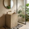 Muniq oblong quarry stone freestanding basin SNK 50 natural sandy beige square monolith pedestal sink 600x450x850mm with river pebble surround in biophilic bathroom