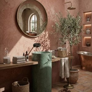 Close-up of deep Evergreen through-body pigmented smooth concrete surface on Helix handcrafted freestanding cylinder pedestal basin SNK10