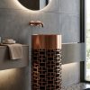 SS CNC Rose Gold Black freestanding stainless steel pedestal basin with intricate laser-cut rose gold geometric lattice pattern over black base in modern concrete bathroom