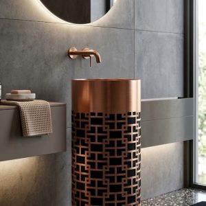 SS CNC Rose Gold Black freestanding stainless steel pedestal basin with intricate laser-cut rose gold geometric lattice pattern over black base in modern concrete bathroom