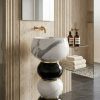 Muniq freestanding bicolour bubble stack basin with alternating Italian black and white marble spheres and 3 polished gold brass rings in luxury travertine bathroom