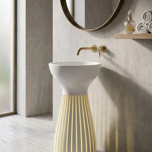 Luma White freestanding artificial stone pedestal basin featuring a sculptural hourglass silhouette with elegant vertical fluted detailing and matte white finish