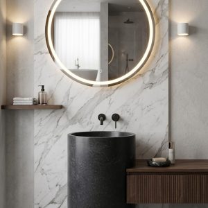 Muniq Halo metallic grey stone freestanding basin SNK 150 dark charcoal cylinder pedestal sink 430x610mm with LED halo mirror and warm ambient wall lighting in luxury bathroom