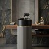 Muniq artificial stone pedestal basin 1325 450x850mm showing deep muted olive green fluted cylinder pedestal with matte black bowl and precision gold ring accent botanical luxury washbasin