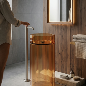 Close-up of crystal clear amber orange transparent resin surface on Orange freestanding cylinder pedestal basin 7103 showing warm colour depth