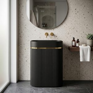 Muniq artificial stone pedestal basin 1344 600x375x850mm showing total uniform matte black fluted oval column pedestal and bowl with precision gold ring accent dramatic luxury washbasin