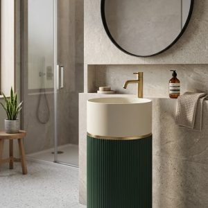 Muniq artificial stone pedestal basin 1326 450x850mm showing rich saturated emerald green fluted cylinder pedestal with clean white bowl and precision gold ring accent jewel tone luxury washbasin