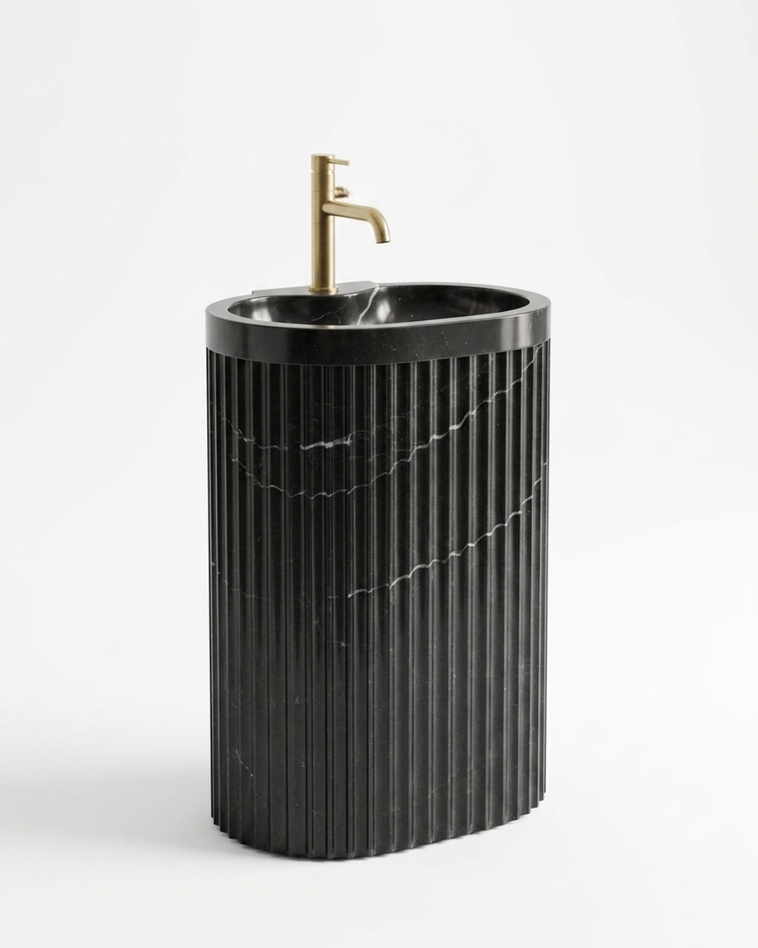 Muniq Fluted Nero Marquina Marble Basin in Dark Luxury Bathroom Interior with Gold Tap Muniq fluted Nero Marquina marble basin freestanding pedestal sink in moody dark luxury bathroom with black marble wall cladding brushed gold tap and indoor plant
