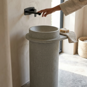 Close-up of wide flat rim detail on Florence handcrafted concrete freestanding tapered cylinder pedestal washbasin