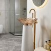 Freestanding white amber resin basin with wide rose gold faceted petal edge resin bowl and gold waste coupling on white speckled cone pedestal with gold floor faucet