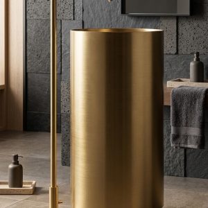 Aurum Gold freestanding stainless steel pedestal basin featuring a brushed gold metallic finish and cylindrical design paired with a luxury gold floor-mounted faucet