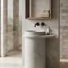 : Florence freestanding concrete tapered cylinder pedestal basin with wide flat rim and deck-mounted black faucet in grey colour