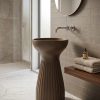 Muniq artificial stone pedestal basin 1340 400x850mm showing warm bronze brown fluted hourglass goblet silhouette with concave waist and smooth flared bowl sculptural luxury washbasin