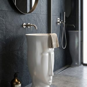 Muniq artificial stone face sculpture basin 1313 400x860mm showing abstract modernist face form in flawless brilliant white engineered stone with open oval bowl at the crown