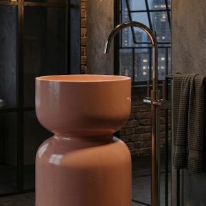 Close-up of colour-matched waste coupling on Zen Sink handcrafted concrete hourglass freestanding pedestal basin SNK440