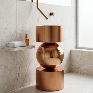 Muniq SS Globe rose gold sphere basin 108 with matte rose gold stainless steel drum base mirror-polished rose gold sphere and matching drum bowl against dark slate herringbone tile wall