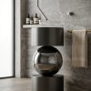 Muniq sculptural steel sphere basin with matte gunmetal steel drum base mirror-polished reflective sphere and matching drum bowl in contemporary luxury bathroom with stone wall and warm timber floor