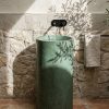 Helix freestanding concrete cylinder pedestal basin SNK10 in deep Evergreen colour with smooth pigmented finish and matte black deck faucet in natural light
