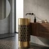 SS CNC Gold Black freestanding stainless steel pedestal basin with intricate laser-cut gold geometric lattice pattern overlaying solid black base cylinder