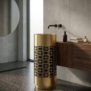 SS CNC Gold Black freestanding stainless steel pedestal basin with intricate laser-cut gold geometric lattice pattern overlaying solid black base cylinder