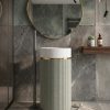 Muniq artificial stone pedestal basin 1304 400x860mm showing sage green fluted cylinder pedestal with white terrazzo effect bowl and gold ring accent in contemporary bathroom