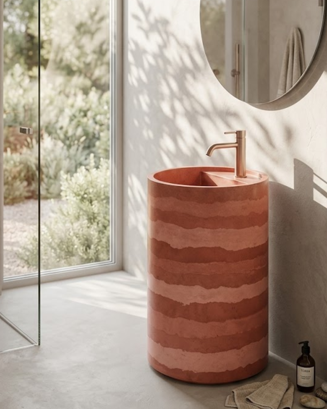 Eclipse Freestanding Concrete Cylinder Basin SNK40 Rammed Earth Stripe Terracotta Eclipse freestanding concrete cylinder pedestal basin SNK40 in Rammed Earth colour with warm terracotta and rust horizontal stripe banding and rose gold faucet in bright luxury bathroom