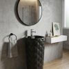 Diamond matt black ceramic freestanding pedestal basin 179 with all-over raised 3D diamond pattern in deep matte black against white bathroom wall with round black mirror