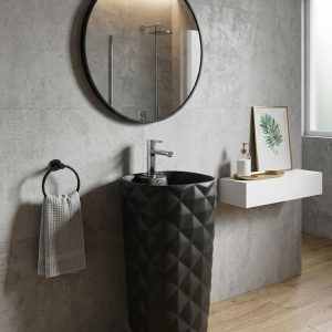 Diamond matt black ceramic freestanding pedestal basin 179 with all-over raised 3D diamond pattern in deep matte black against white bathroom wall with round black mirror
