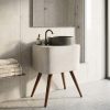 Contemporary vessel basin featuring a chevron textured exterior mounted on a modern vanity stand with tapered wooden legs.
