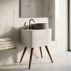Contemporary vessel basin featuring a chevron textured exterior mounted on a modern vanity stand with tapered wooden legs.