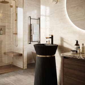 Noir Halo freestanding artificial stone pedestal basin featuring a matte black finish, vertical fluted detailing, and luxury gold accent ring