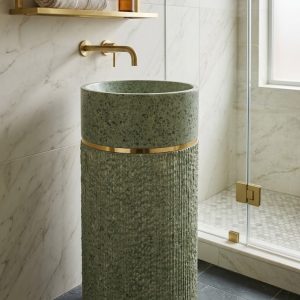 Luxury green terrazzo composite stone freestanding pedestal basin featuring fluted texture and elegant gold accent ring.