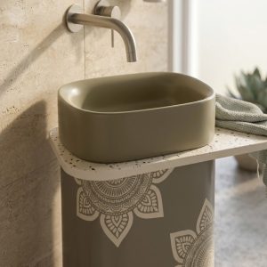 Close-up view of floral mandala patterns on a composite stone pedestal basin with luxury decorative detailing.