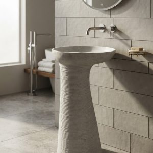 Twisted fluted composite stone freestanding basin with sculptural spiral pedestal and wide contemporary bowl.