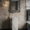 Rectangular composite stone freestanding basin featuring elegant geometric engraved detailing and contemporary architectural design.