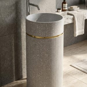 Close-up of terrazzo-inspired composite stone basin featuring subtle stone flecks and premium ivory finish.
