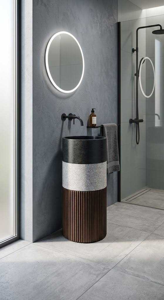 Luxury composite stone freestanding basin featuring a dark vessel bowl, contrasting stone band, and fluted pedestal base.